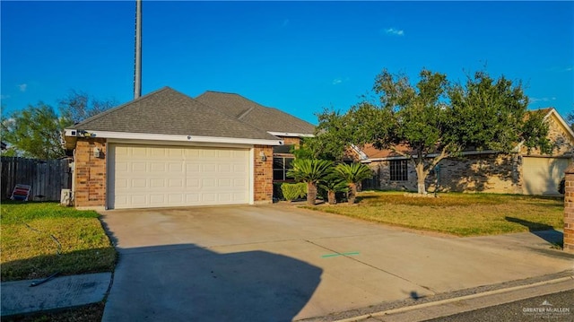 view of front facade with a garage and a front lawn