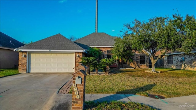 ranch-style house featuring a garage and a front lawn