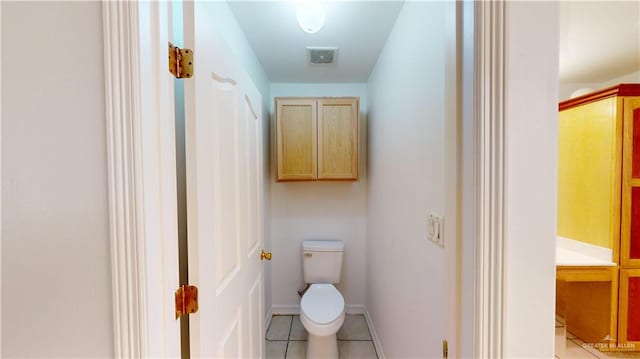 bathroom featuring tile patterned floors and toilet