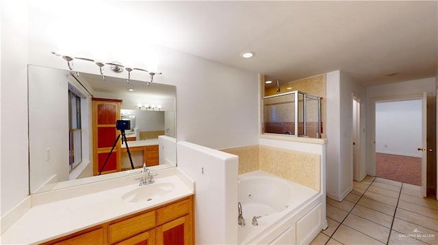 bathroom featuring tile patterned flooring, vanity, and independent shower and bath