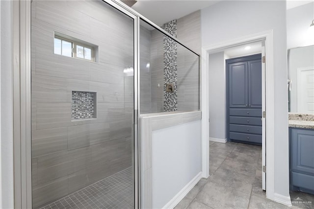 bathroom featuring vanity and an enclosed shower