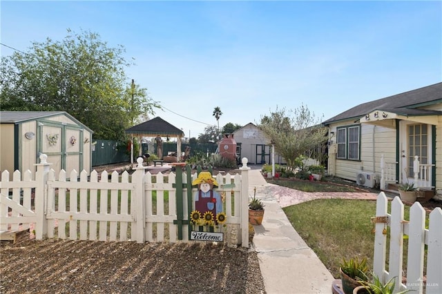 view of yard with a gazebo, ac unit, and a shed