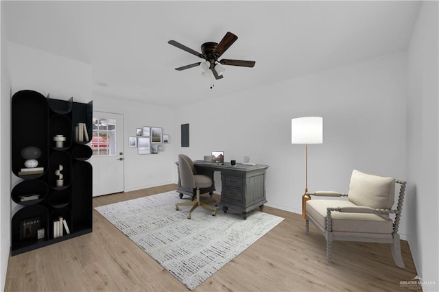 office with ceiling fan and light hardwood / wood-style floors