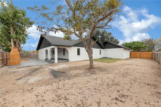 back of house featuring a patio area