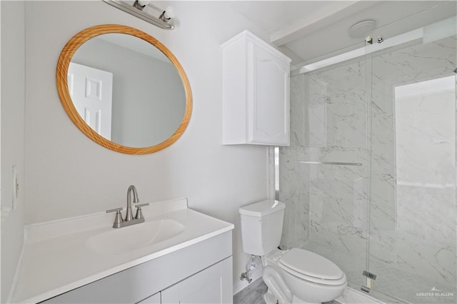 full bath with a marble finish shower, toilet, and vanity