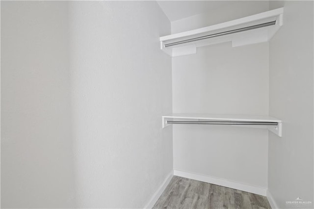 spacious closet with wood finished floors