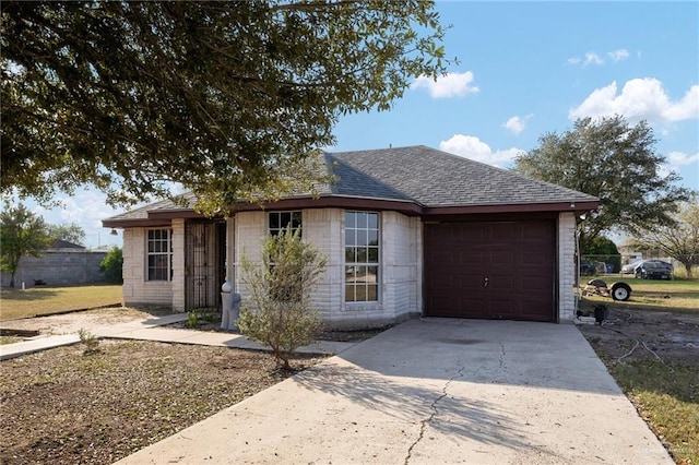 ranch-style home featuring a garage