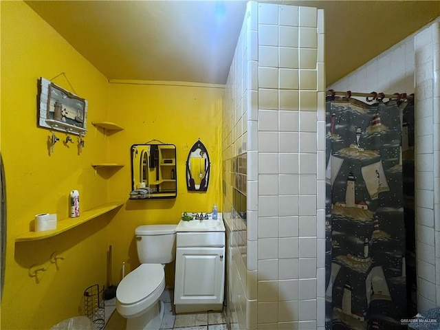 bathroom with sink, tile patterned flooring, and toilet