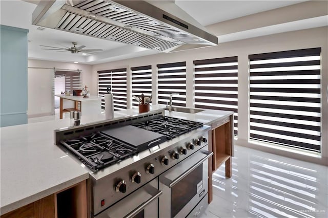 5804 La Quinta Ln, Weslaco, TX 78599 - kitchen with high end stove, ventilation hood, and a ceiling fan