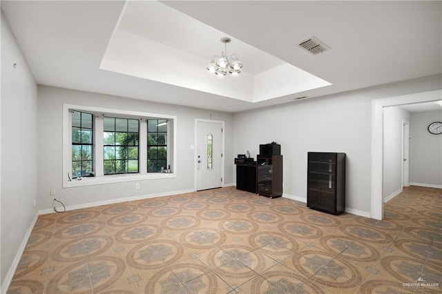 unfurnished living room with a chandelier