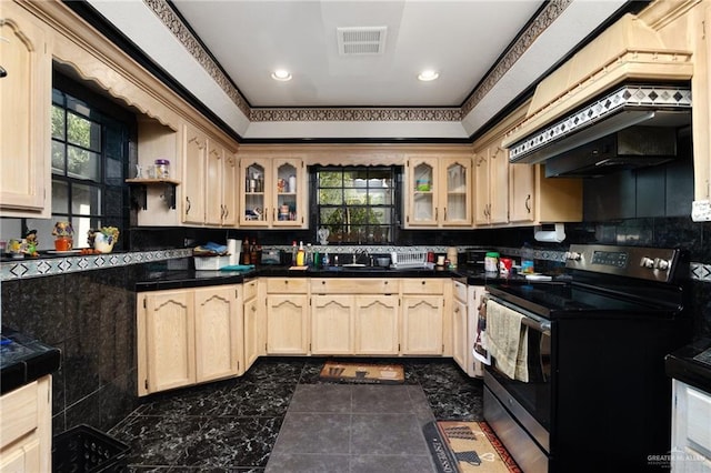 kitchen with light brown cabinets, exhaust hood, ornamental molding, and stainless steel electric range