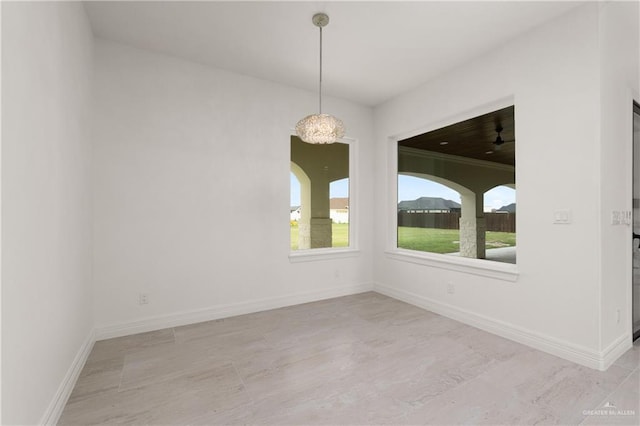 5407 Common Ln, Weslaco, TX 78596 - unfurnished dining area with baseboards