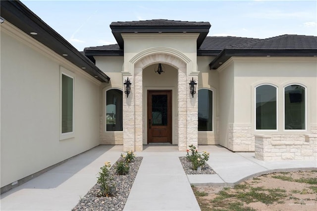 5407 Common Ln, Weslaco, TX 78596 - view of exterior entry featuring stone siding and stucco siding