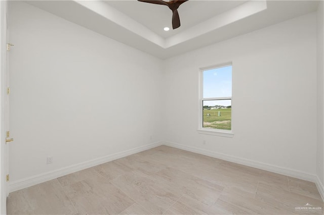 5407 Common Ln, Weslaco, TX 78596 - empty room featuring a tray ceiling, a ceiling fan, baseboards, and recessed lighting