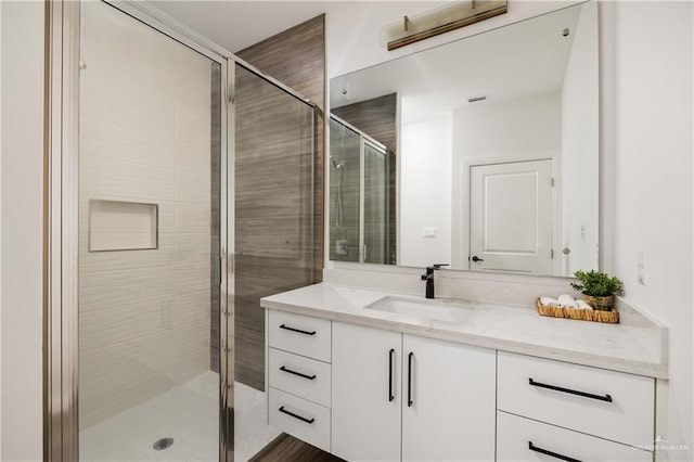 bathroom featuring vanity and walk in shower