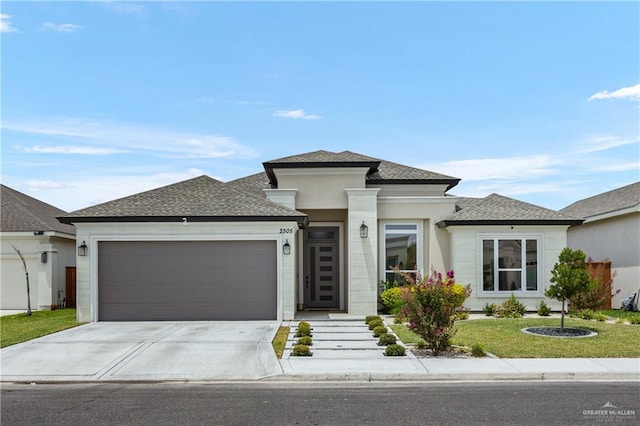 prairie-style home with a front lawn and a garage