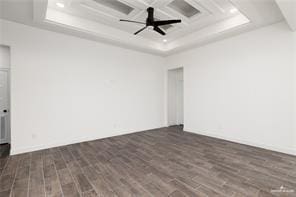 unfurnished room with recessed lighting, coffered ceiling, a raised ceiling, wood finished floors, and ceiling fan