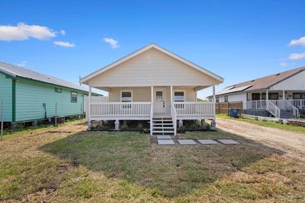 1311 Carlos Dr, Alamo, TX 78516 - view of front of home featuring covered porch and a front yard
