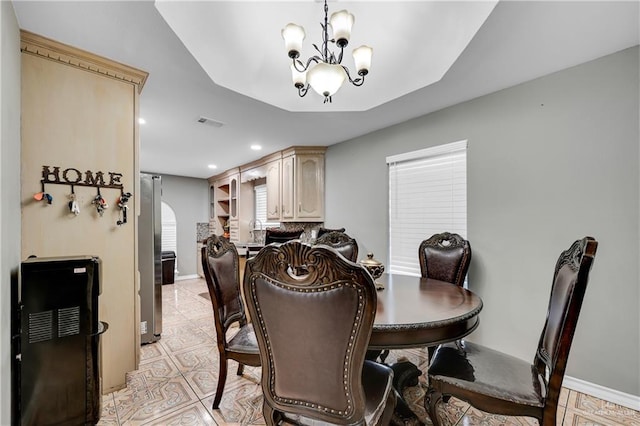 dining area featuring an inviting chandelier