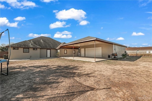 rear view of property with a patio area