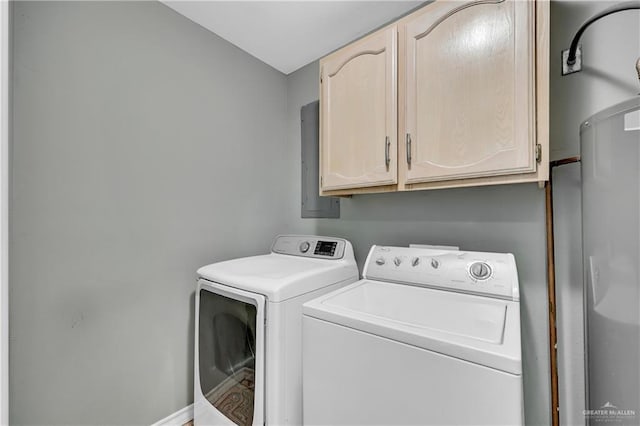 washroom featuring cabinets and washing machine and clothes dryer