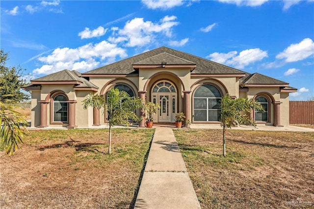 301 S El Faro Rd, Sullivan City, TX 78595 - mediterranean / spanish home with a front lawn and french doors
