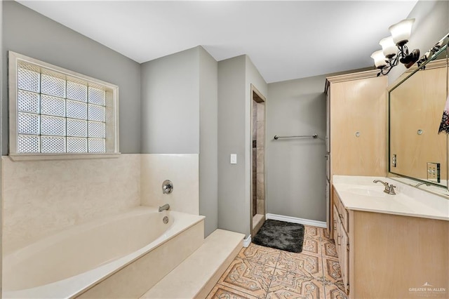 bathroom featuring a washtub, vanity, and tile patterned floors