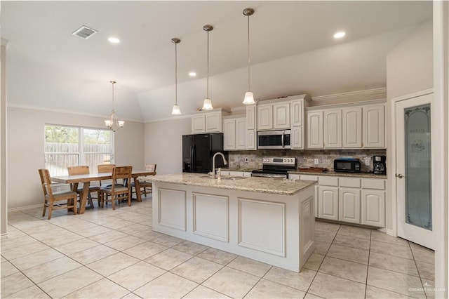 kitchen with a sink, tasteful backsplash, vaulted ceiling, a chandelier, and black appliances
