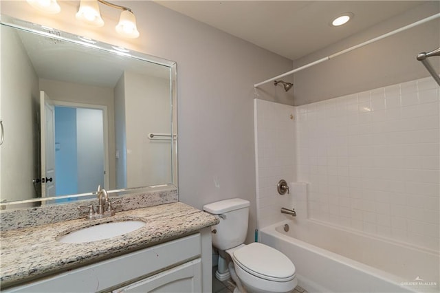 full bathroom featuring shower / bath combination, vanity, and toilet