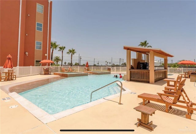 view of swimming pool featuring a patio