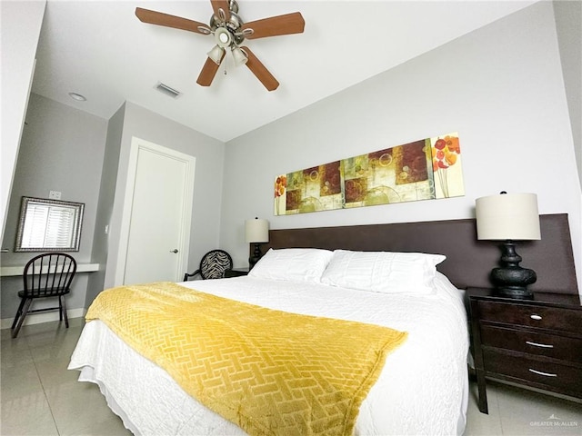 bedroom featuring light tile patterned flooring and ceiling fan