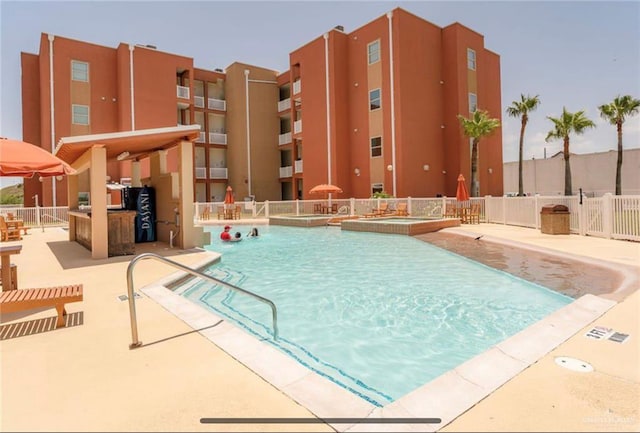 view of pool featuring a patio area