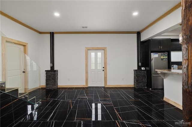 2115 Mile 3 N, Mercedes, TX 78570 - unfurnished living room with ornamental molding, baseboards, recessed lighting, and a wood stove