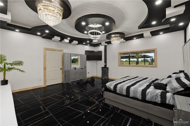 2115 Mile 3 N, Mercedes, TX 78570 - bedroom featuring a chandelier, baseboards, and a tray ceiling