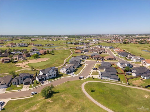 bird's eye view with view of golf course and a residential view