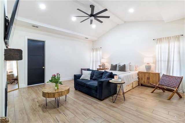 bedroom featuring vaulted ceiling with beams, light wood-style floors, visible vents, and baseboards