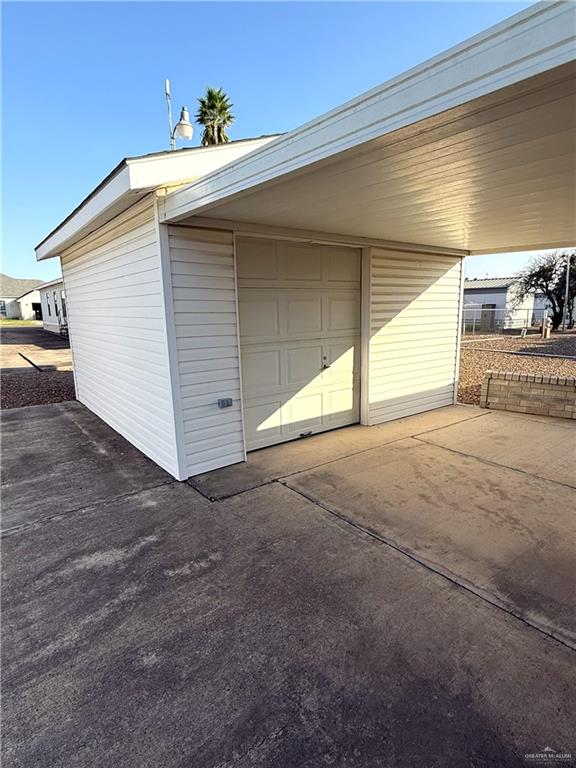 garage with a carport