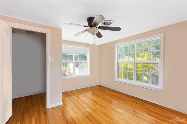 unfurnished bedroom with light hardwood / wood-style floors and ceiling fan