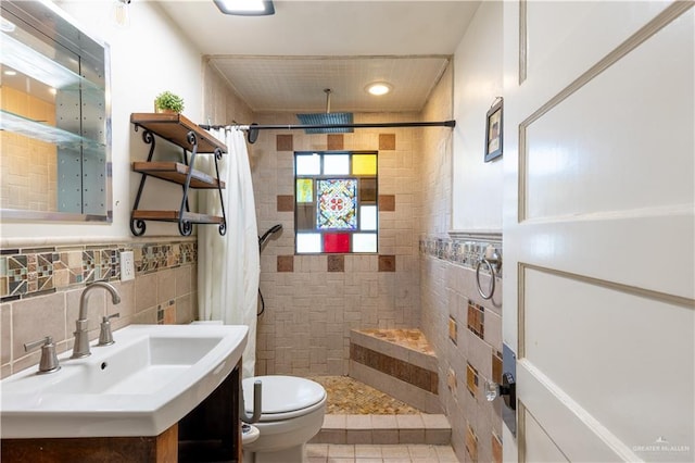 bathroom with toilet, tile walls, vanity, a shower with shower curtain, and backsplash