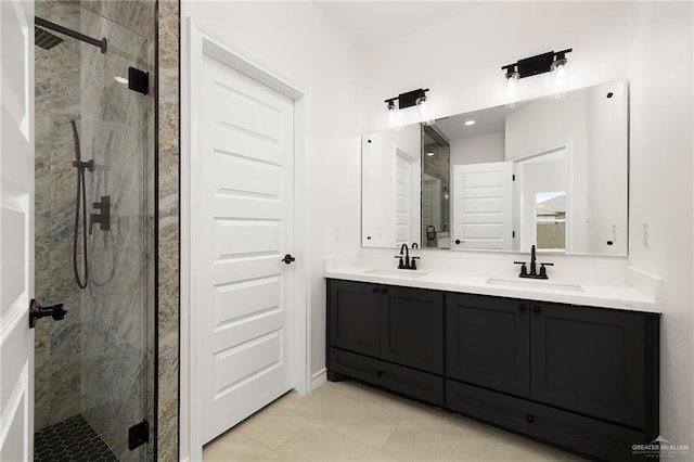 full bath with double vanity, a stall shower, and a sink