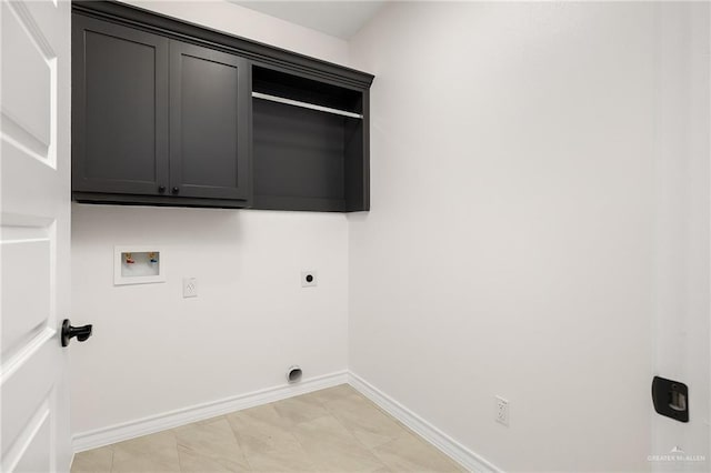 laundry room featuring hookup for a washing machine, cabinet space, baseboards, and electric dryer hookup