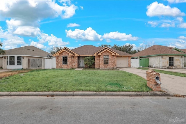 ranch-style house with a garage and a front lawn