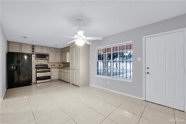 kitchen featuring light tile patterned floors, ceiling fan, appliances with stainless steel finishes, a textured ceiling, and decorative backsplash