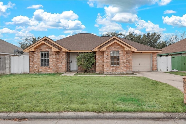 ranch-style house featuring a garage and a front lawn