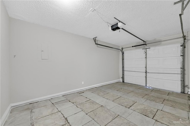 garage featuring a garage door opener and electric panel