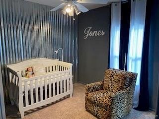 carpeted bedroom featuring ceiling fan