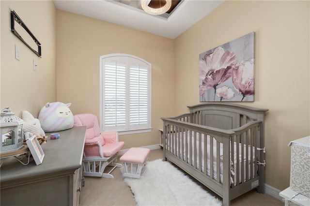 bedroom featuring a nursery area