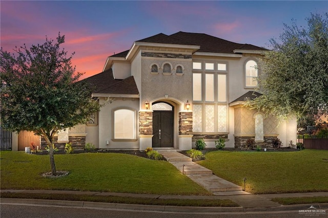 view of front of property with a yard