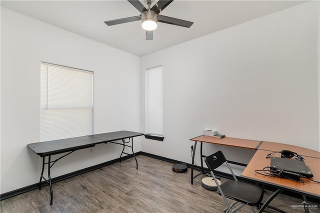 home office with hardwood / wood-style flooring and ceiling fan