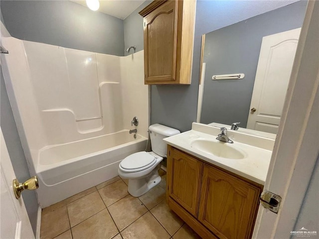 full bathroom featuring toilet, tile patterned flooring, washtub / shower combination, and vanity